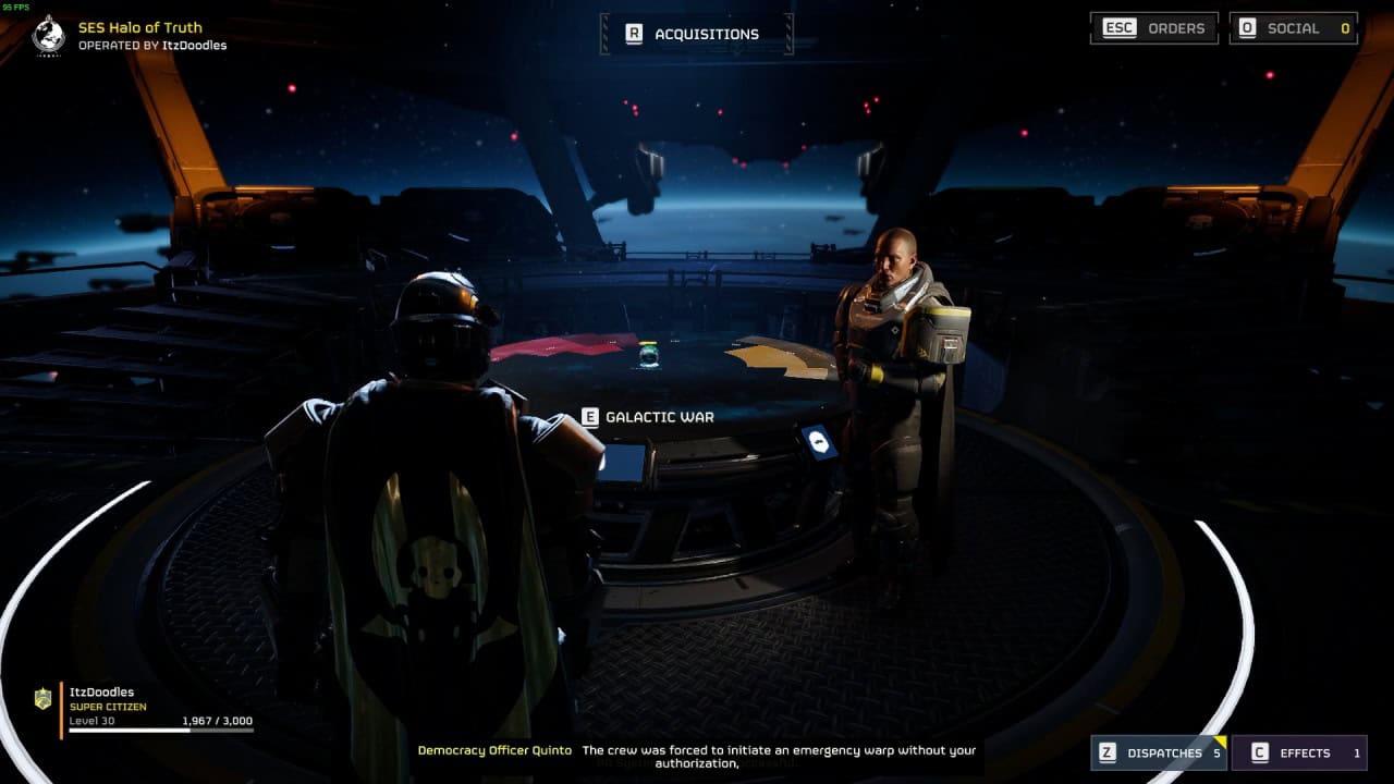 A space-themed video game scene reminiscent of Helldivers 2 shows two characters in futuristic suits standing around a strategic table displaying a galactic map. Various interface elements and mission details are visible on screen, enhancing the immersive experience.