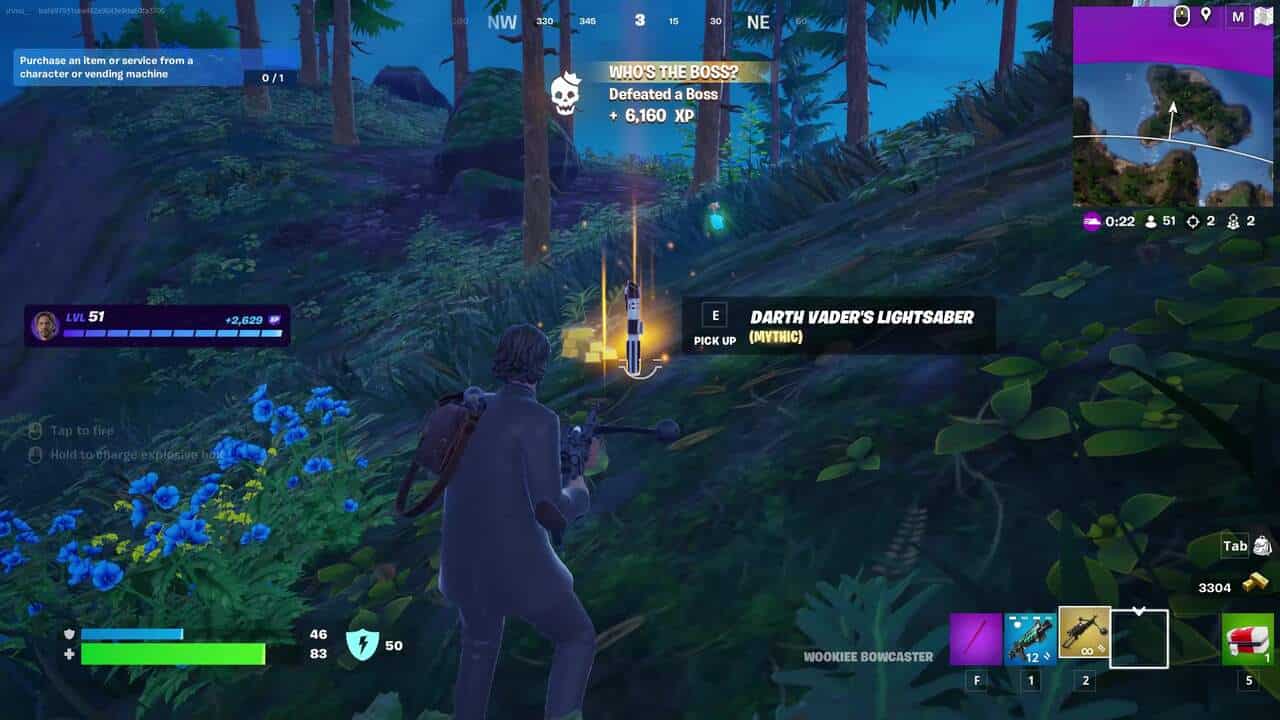 Lightsabers back in Fortnite: A player on a grassy hill looking at Dark Vader's Lightsaber on the ground ahead of them in Fortnite.