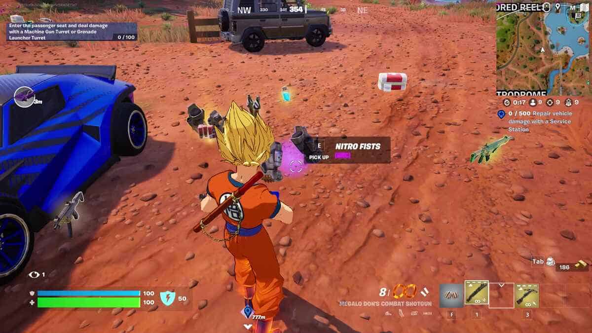 Fortnite Nitro Fists: A player looking at some Nitro Fists on the ground amongst some other items.