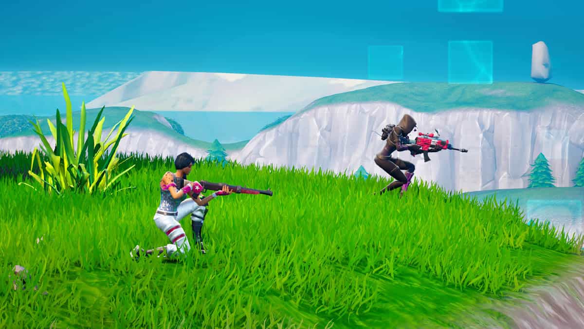 A group of fortnite enthusiasts are playing the game in a grassy field.