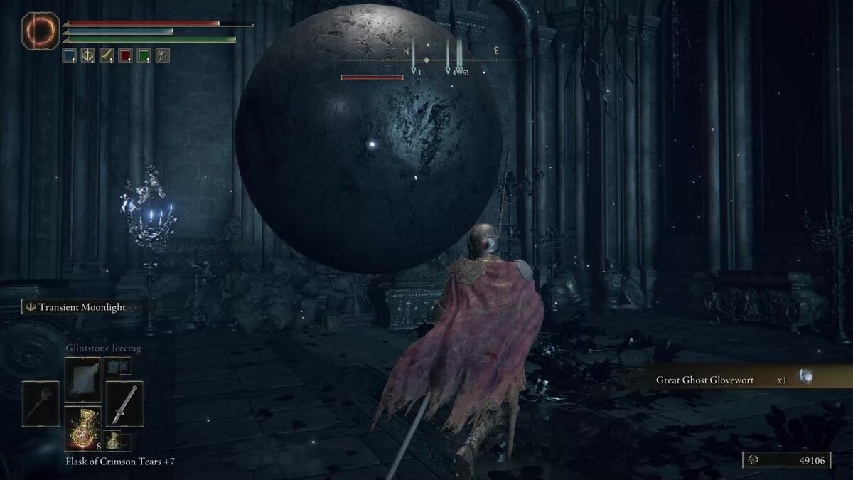 FromSoftware games are not that hard: A player in Elden Ring fighting against a giant metal sphere in an ornate stone room.