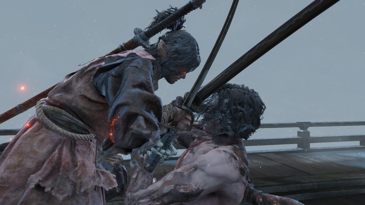 FromSoftware games are not that hard: Sekiro and Genichiro crossing swords at the end of their fight.