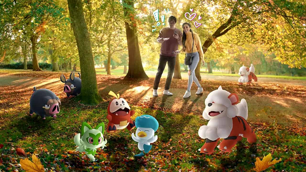 A couple looks at Pokemon in the park in Pokemon GO