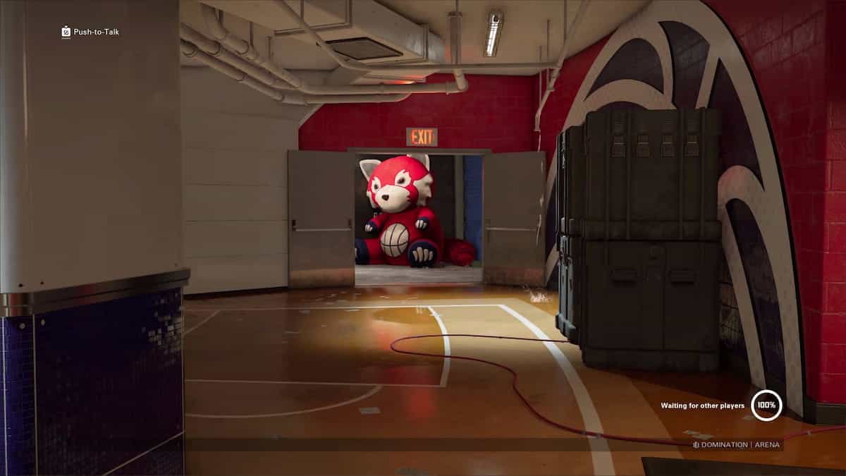 Xdefiant maps: a hallway in a building leads to a door with a large red panda mascot sitting against the wall in the doorway.