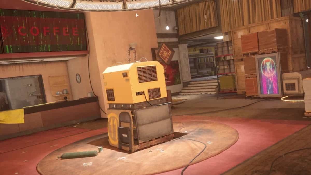 Xdefiant maps: a cluttered room with a yellow machine in the center, a "COFFEE" sign on the wall, and various items and boxes scattered around.