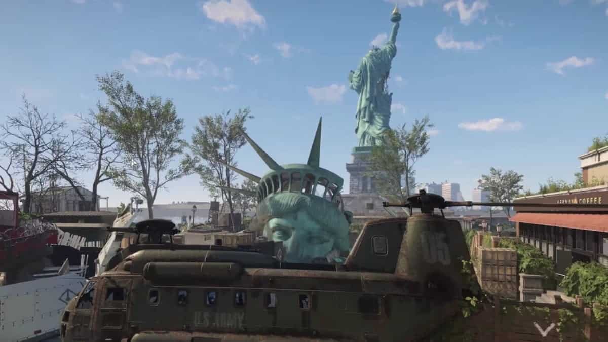 Xdefiant maps: scene with the Statue of Liberty in the background. A helicopter with "U.S. Army" is in the foreground, alongside the fallen face of the Statue of Liberty.