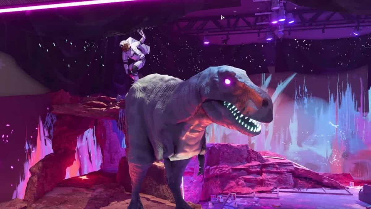 Xdefiant maps: an astronaut rides a large animatronic dinosaur with glowing eyes and teeth a the Hollywood set.